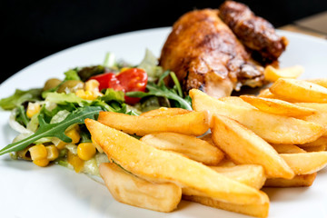Fresh chicken steak with tomatoes and french fries