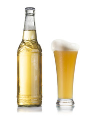 Beer bottle and glass with water drops isolated on white background.