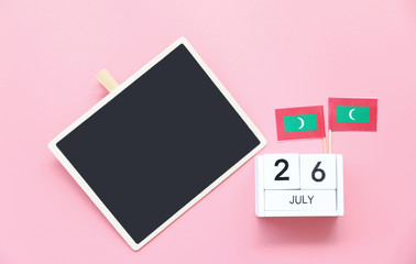 July 26 Wooden calendar and blackboard Concept independence day of Maldives and Maldives national day.Copy space,minimal style