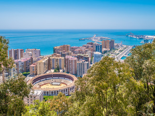 View of Malaga and the Bullring in a summer day with  blue sky, Spain