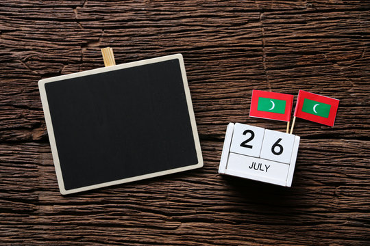 July 26 Wooden calendar on wooden table Concept independence day of Maldives and Maldives national day.Copy space,minimal style