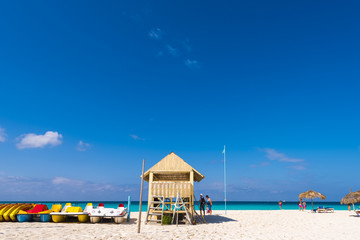 Observation tower on the sandy beach of the Playa Paradise, on the island of Cayo Largo, Cuba. Copy space for text.