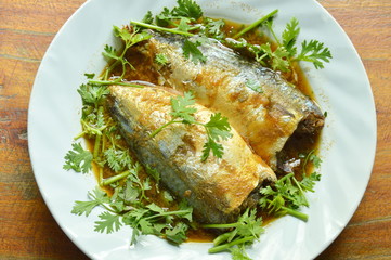 boiled mackerel fish sauce soup topping parsley on plate