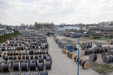 A large stock of coils with wires outdoors