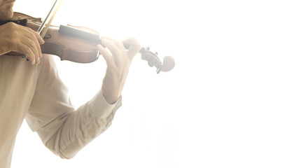 Violinist against a white background playing the violin in a concert. Empty copy space for Editor's text.