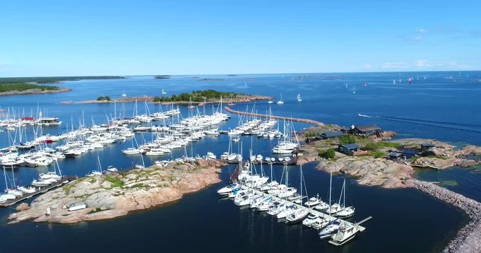 Hanko, Cinema 4k aerial view around ita-satama, full of boats, revealing the city, on Hango regatta day, in Uusimaa, Finland