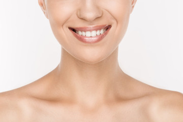 Obraz premium cropped view of smiling naked woman with perfect skin isolated on white