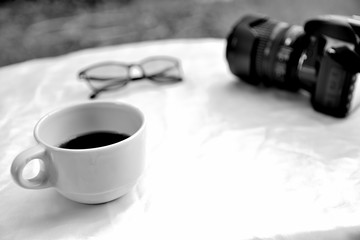 Monochrome cup of coffee on white table