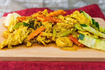 wok fried chicken stir fry with sweet peppers and chinese vegetables