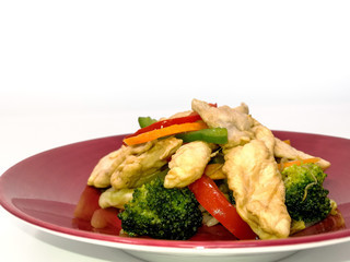 wok fried chicken stir fry with sweet peppers and chinese vegetables