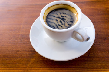 wonderful white cup of hot coffee on table