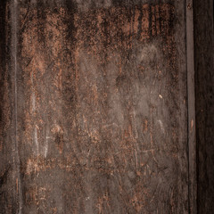 Wooden brown background grunge texture dark color. Textured Wall with scratches, weathered wood surface.