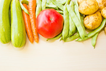 Fresh vegetables on white wood background. Layout for menu or recipe
