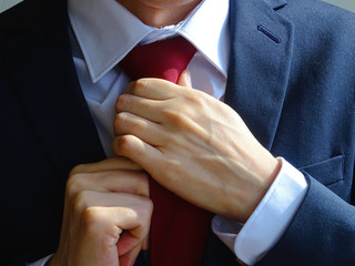A man tying a tie