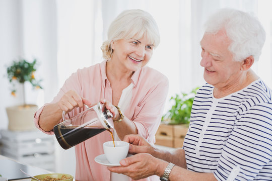 Senior Woman Pouring Coffee