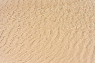 Obraz na płótnie Canvas Sand texture. Sandy beach for background. Top view.