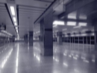 Blurry abstract interior of empty dark subway station