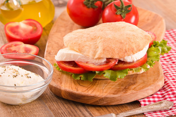 Puccia bread with mozzarella and tomato. 