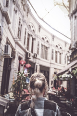 Fototapeta na wymiar Girl walking on old streets of Bucharest. Romania. Europe. Traveler. City Brake