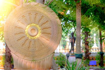 Vintage image style, The Wheel of Dharma of temple garden with sunlight  in Bangkok, Thailand