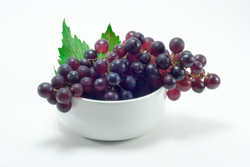 Grapes in a white cup