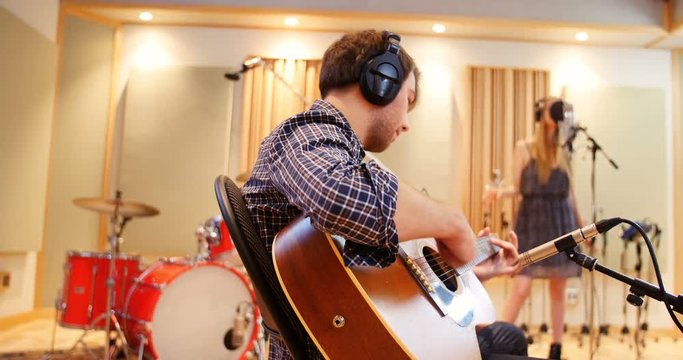 Music band performing in a studio