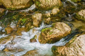 Naklejka na ściany i meble Mountain stream with stones in forest - Cheile Bicazului, Transylvania, Romania
