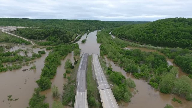 Aerial view of a flooded river covering an interstate highway