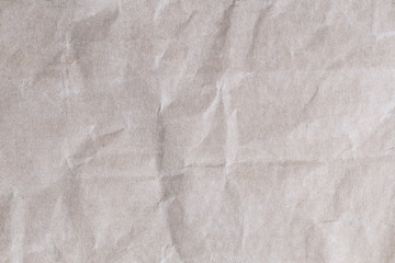 Old brown paper texture background with wrinkles.