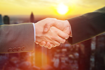 Hands shaking at sunset or sunrise