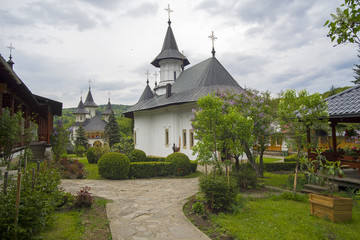 Fototapeta na wymiar Garden at orthodox monastery of Sihastria