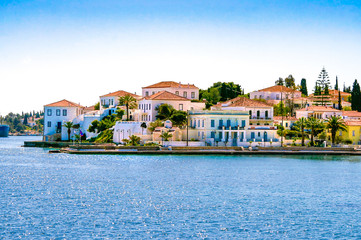 Buildings of Spetses island on Saronic gulf near Athens. Ideal travel destination for quiet vacations . Greece - obrazy, fototapety, plakaty