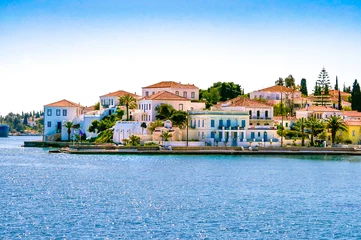 Tuinposter Buildings of Spetses island on Saronic gulf near Athens. Ideal travel destination for quiet vacations . Greece © Stratos Giannikos