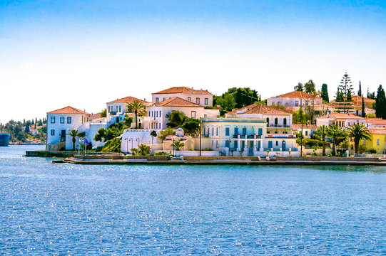 Fototapeta Buildings of Spetses island on Saronic gulf near Athens. Ideal travel destination for quiet vacations . Greece