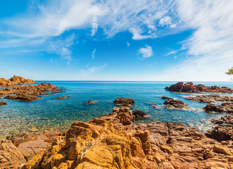 Rocks and blue sea in Su Sirboni beach