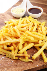 Close up Crispy Potato Fries with Two Dipping Sauce, Served on R