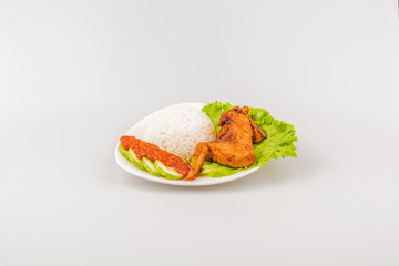 Isolated Ayam goreng penyet, fried chicken ala Indonesia, Indonesian food with condiments