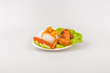 Isolated Ayam goreng penyet, fried chicken ala Indonesia, Indonesian food with condiments
