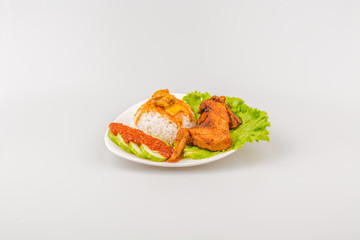 Isolated Ayam goreng penyet, fried chicken ala Indonesia, Indonesian food with condiments