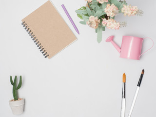 Flat lay, top view office table desk frame. feminine desk workspace with laptop, watch on white background.Love concept top view composition.note for something in love emotion.