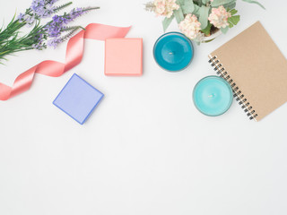 Flat lay, top view office table desk frame. feminine desk workspace with laptop, watch on white background.Love concept top view composition.note for something in love emotion.