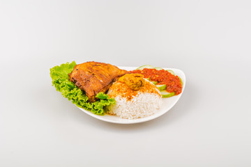 Isolated Ayam goreng penyet, fried chicken ala Indonesia, Indonesian food with condiments