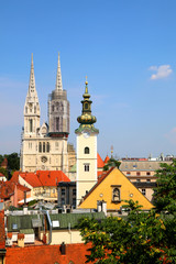 Fototapeta na wymiar Zagreb skyline with Zagreb Cathedral and St. Mary Church. View from Strossmayer Promenade on Upper Town. 