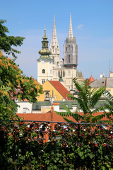 Love locks on Strossmayer Promenade in Zagreb Upper Town. Zagreb Cathedral and St. Mary Church in the background.
