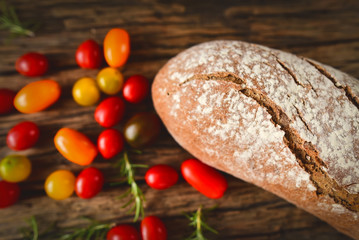 Bread with multicolored tomatoes  - obrazy, fototapety, plakaty