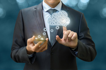 The businessman downloads data from the cloud .