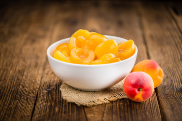 Pickled Apricots (selective focus) on vintage wooden background