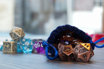 A set of polyhedral dice with a draw string bag