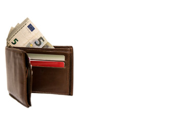 Brown wallet with money on white background
