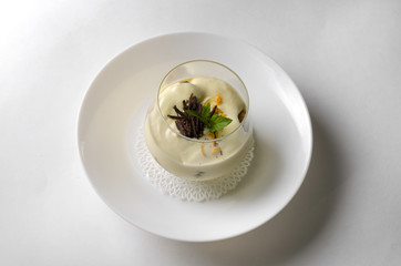 Dessert tiramisu with mint in a transparent glass